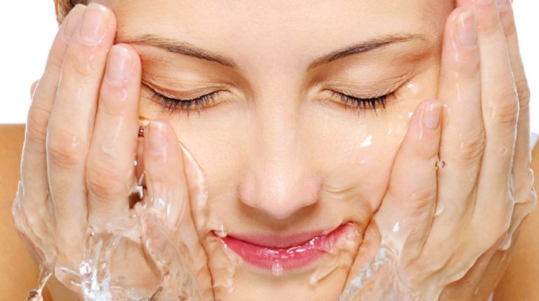 girl washing face with salicylic acid face wash